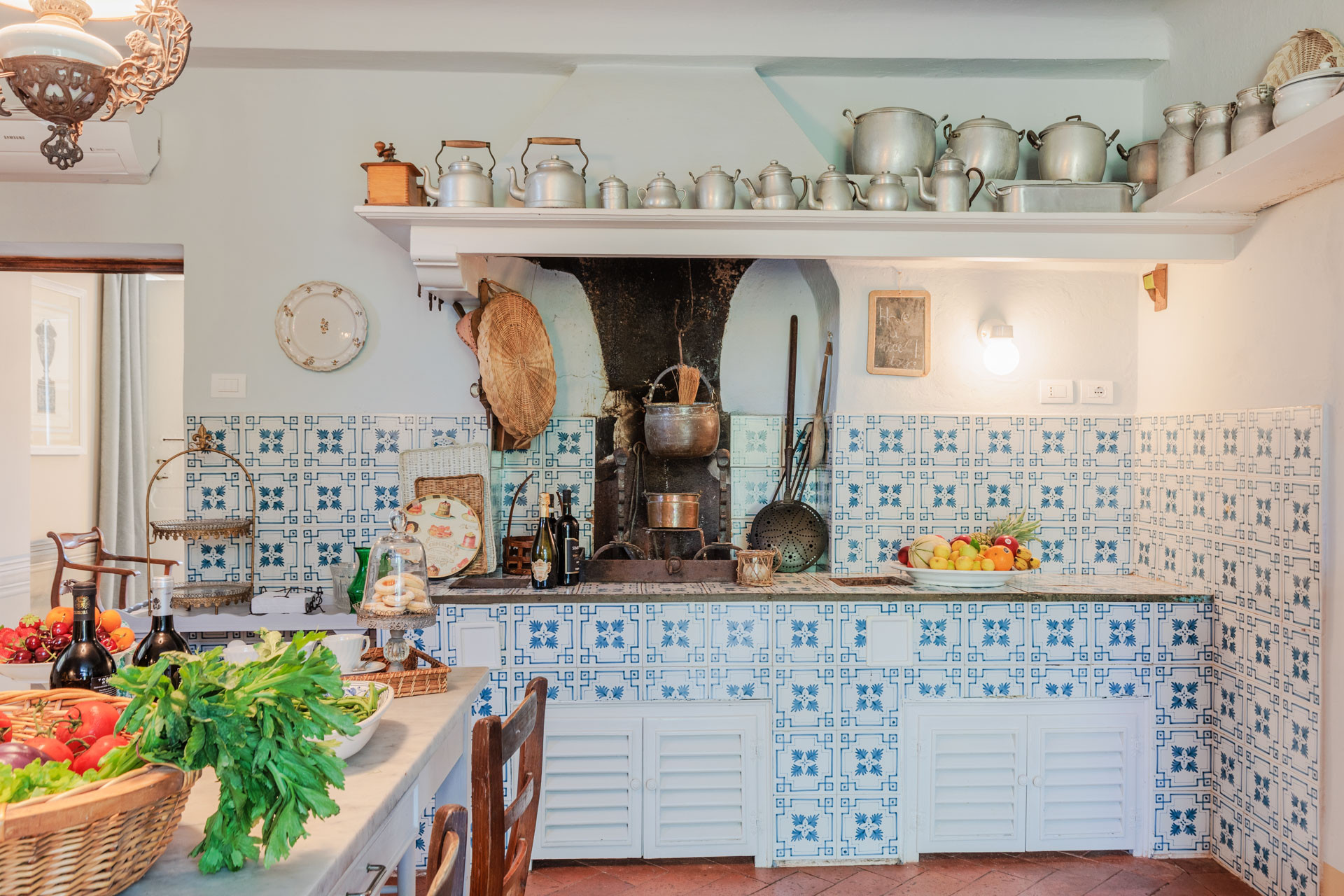 Traditional Tuscan kitchen with blue and white tiles